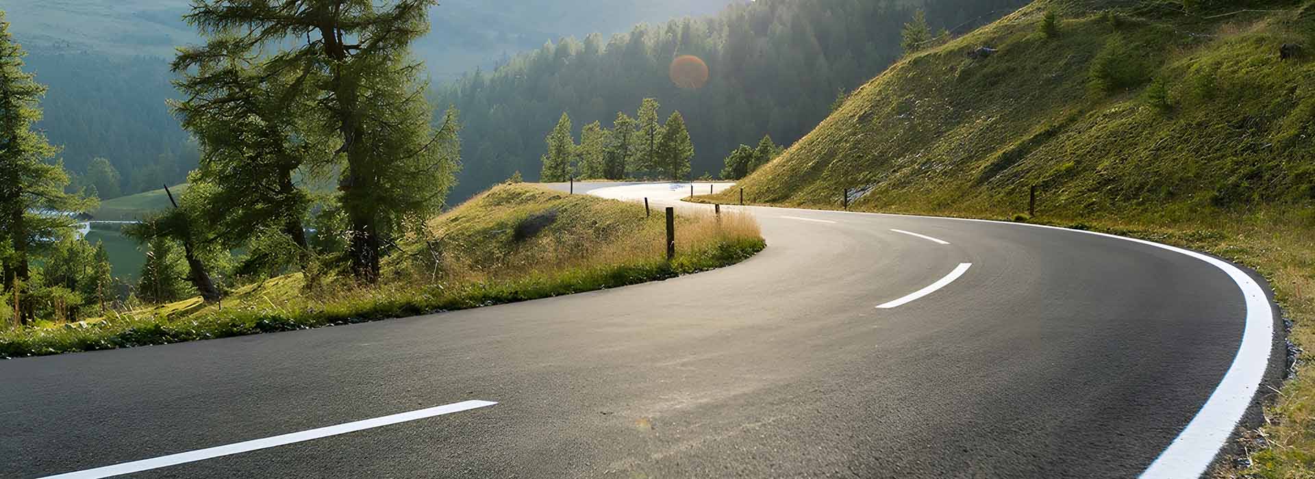 green asphalt road paved by asphalt paving equipment for sale